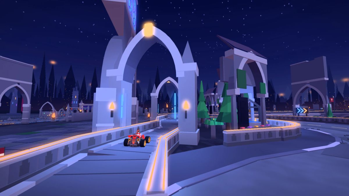 A kart entering the narrow cloister route beneath ruined arches beside a stone courtyard and green banners.