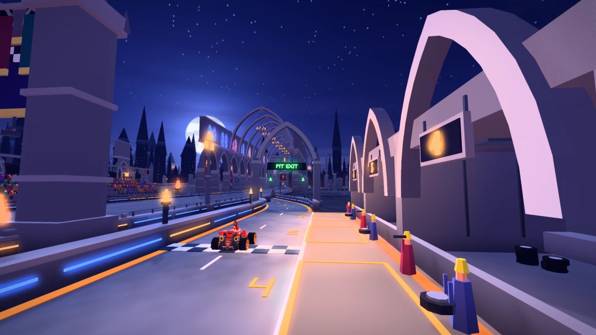 A red kart driving along the illuminated pit lane beside stone service bays, with the cathedral nave visible ahead.