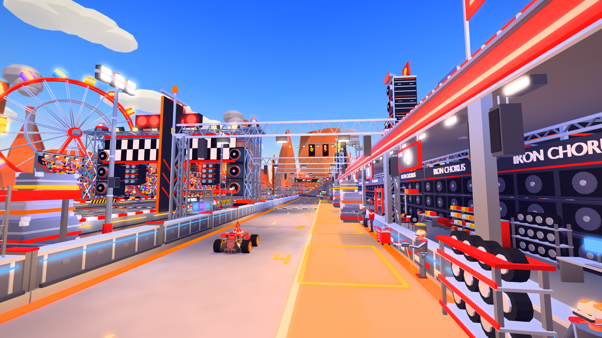 The new pitlane beside the Iron Chorus start and finish straight, with service bays, a pit wall and backstage equipment.