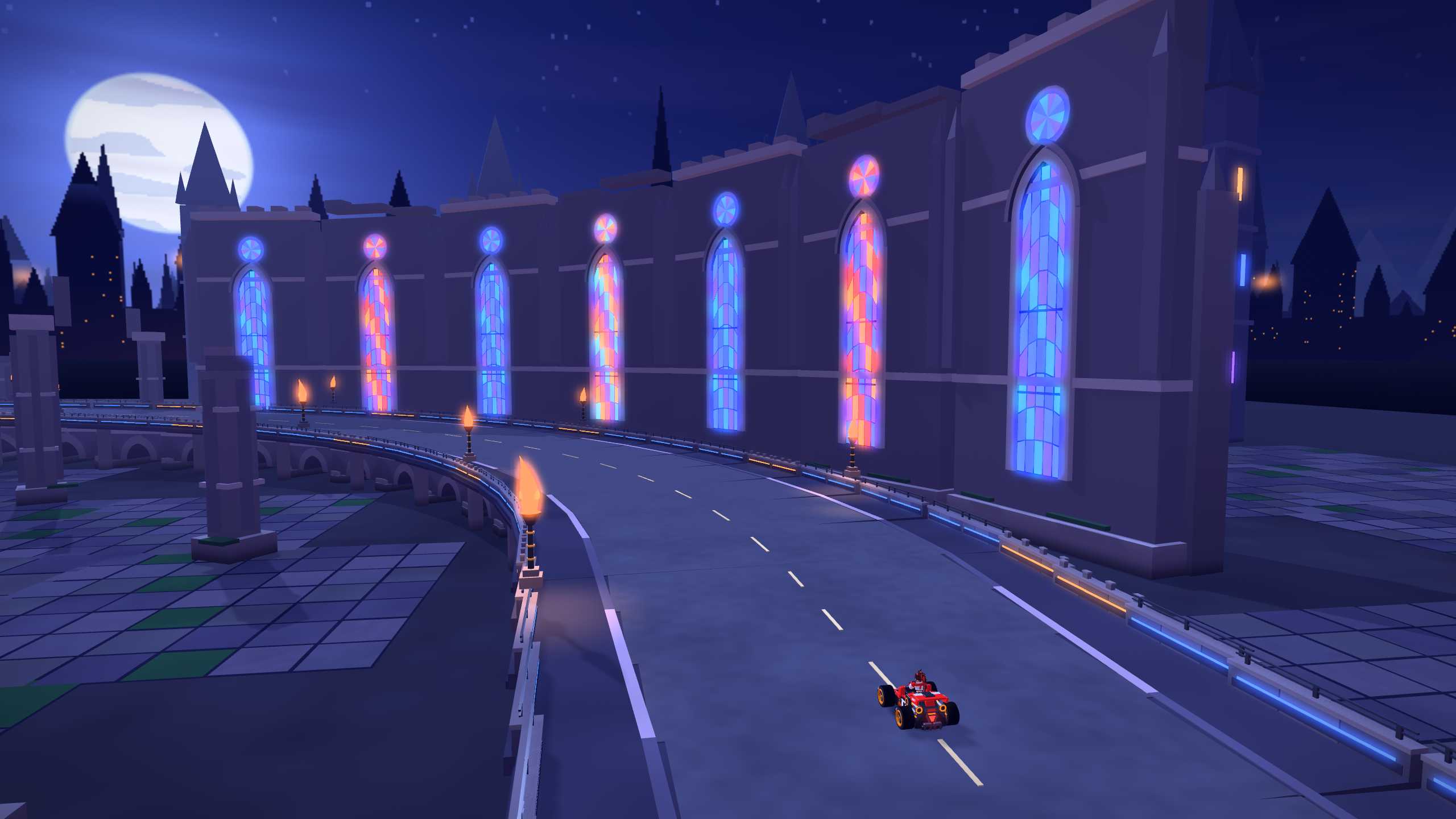 Work-in-progress Riff Racers track at night, with a curved road running past a large building with glowing stained-glass windows.
